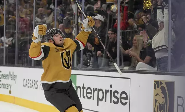 Vegas Golden Knights center Ivan Barbashev (49) celebrates after scoring against the Vancouver Canucks during the second period of an NHL hockey game Saturday, Feb. 22, 2025, in Las Vegas. (AP Photo/John Locher)