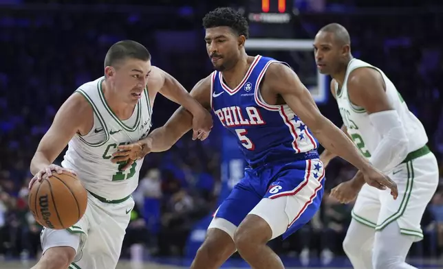 Boston Celtics' Payton Pritchard, left, tries to get past Philadelphia 76ers' Quentin Grimes, center, during the first half of an NBA basketball game, Thursday, Feb. 20, 2025, in Philadelphia. (AP Photo/Matt Slocum)
