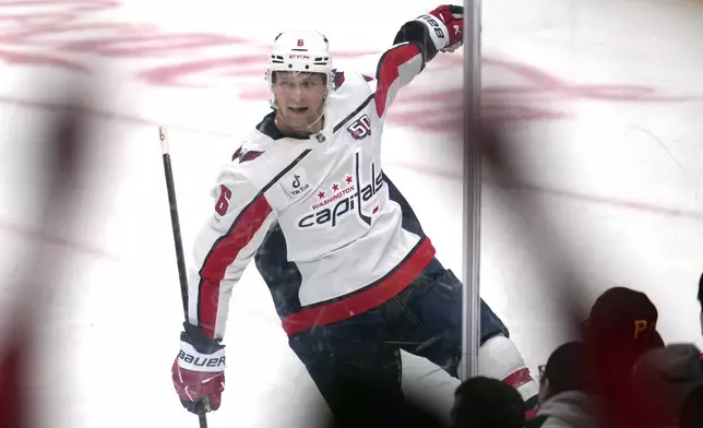 Washington Capitals' Jakob Chychrun (6) celebrates after scoring his first goal during the second period of an NHL hockey game against the Pittsburgh Penguins in Pittsburgh, Saturday, Feb. 22, 2025. (AP Photo/Gene J. Puskar)