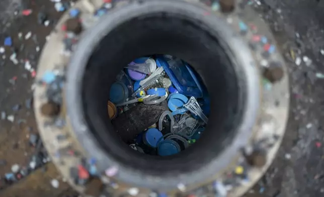 Different types of plastic are seen inside Petgaserita, a non-catalytic pyrolysis machine, which will be converted into fuel, in Boca del Rio, Veracruz, Mexico, Jan. 4, 2025. (AP Photo/Felix Marquez)