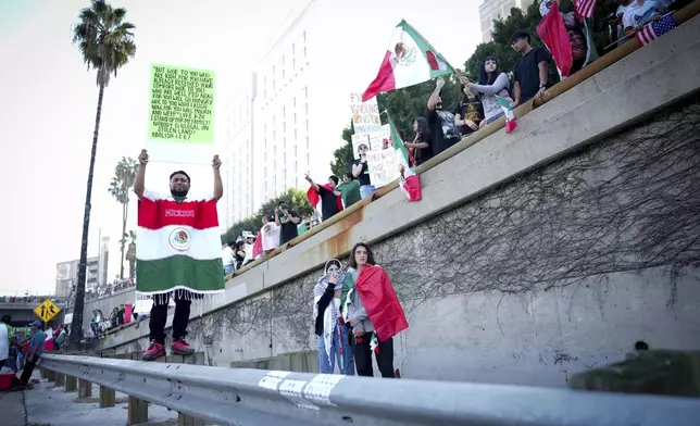 CORRECTS NAME OF THE FREEWAY - Demonstrators shut down the 101 freeway during a protest calling for immigration reform Sunday, Feb. 2, 2025, in Los Angeles. (AP Photo/Eric Thayer)