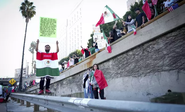 Demonstrators shut down the 110 freeway during a protest calling for immigration reform Sunday, Feb. 2, 2025, in Los Angeles. (AP Photo/Eric Thayer)