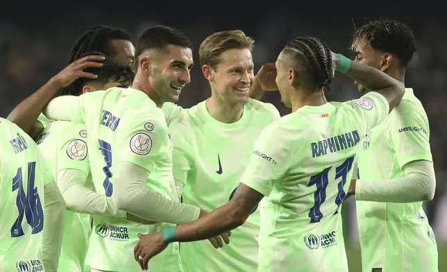 Barcelona's Ferran Torres celebrates his side's fourth goal during a Spanish Copa del Rey, or King's Cup, quarter-final soccer match between Valencia and Barcelona at the Mestalla Stadium in Valencia, Spain, Thursday Feb. 6, 2025. (AP Photo/Alberto Saiz)