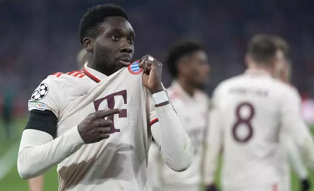 Bayern's Alphonso Davies celebrates after scoring his side's opening goal during the Champions League playoff second leg soccer match between FC Bayern Munich and Celtic Glasgow at the Allianz Arena in Munich, Germany, Tuesday, Feb. 18, 2025. (AP Photo/Matthias Schrader)