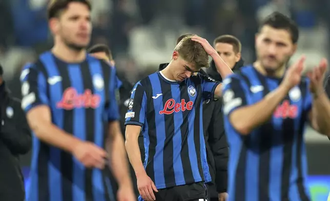 Atalanta's Charles De Ketelaere, center, reacts after a Champions League, playoff second leg, soccer match between Atalanta and Club Brugge in Bergamo, Italy, Tuesday, Feb.18, 2025. (Spada/LaPresse via AP)