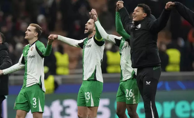 Feyenoord players celebrate after the Champions League, playoff second leg soccer match between AC Milan and Feyenoord, at the San Siro stadium in Milan, Italy, Tuesday, Feb.18, 2025. (AP Photo/Luca Bruno)