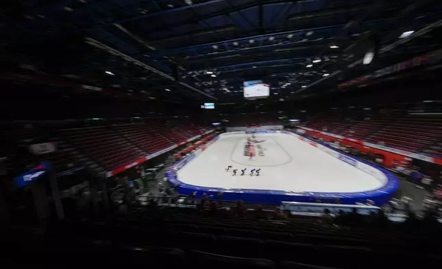 Athletes compete during the Women's 1500 mt. quarterfinal race of the ISU Short Track World Tour, Olympics Milano-Cortina 2026 test event, in Milan, Italy, Friday, Feb. 14, 2025. (AP Photo/Luca Bruno)