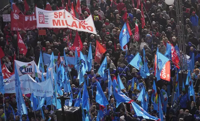 FILE - Demonstrators gather during a public and private sectors' national strike called by the labor unions to protest against the government's budget law in Milan, Italy, Nov. 29, 2024. (AP Photo/Luca Bruno, File)