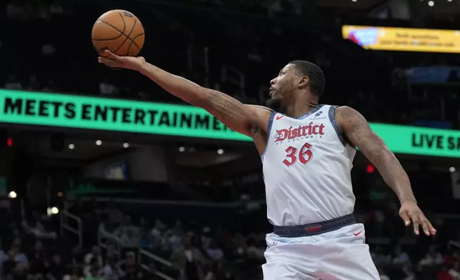Washington Wizards guard Marcus Smart goes up to shoot against the Brooklyn Nets during the first half of an NBA basketball game Monday, Feb. 24, 2025, in Washington. (AP Photo/Jess Rapfogel)