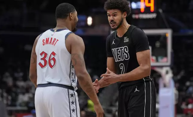 Washington Wizards guard Marcus Smart (36) and Brooklyn Nets forward Cameron Johnson (2) exchange words during the second half of an NBA basketball game, Monday, Feb. 24, 2025, in Washington. (AP Photo/Jess Rapfogel)