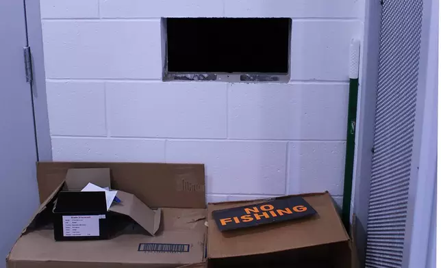 This undated photo provided by the Cullman County Sheriff's Office shows a hole on the wall next to the door to the evidence room at the Hanceville Police Department in Hanceville, Ala. Officials said the evidence room was not kept secure and could be accessed by the hole on the wall. (Cullman County Sheriff's Office via AP)