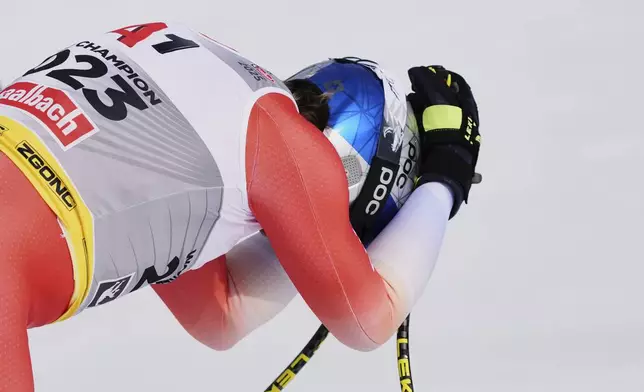 Switzerland's Marco Odermatt reacts with dejection at the finish area of a men's downhill race, at the Alpine Ski World Championships, in Saalbach-Hinterglemm, Austria, Sunday, Feb. 9, 2025. (AP Photo/Giovanni Auletta)