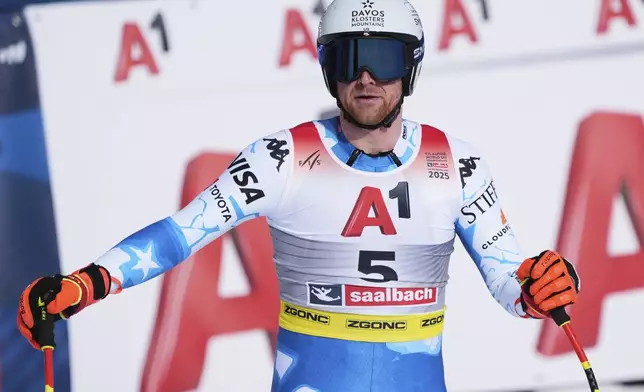 United States' Ryan Cochran Siegle checks his time at the finish area of a men's downhill race, at the Alpine Ski World Championships, in Saalbach-Hinterglemm, Austria, Sunday, Feb. 9, 2025. (AP Photo/Giovanni Auletta)