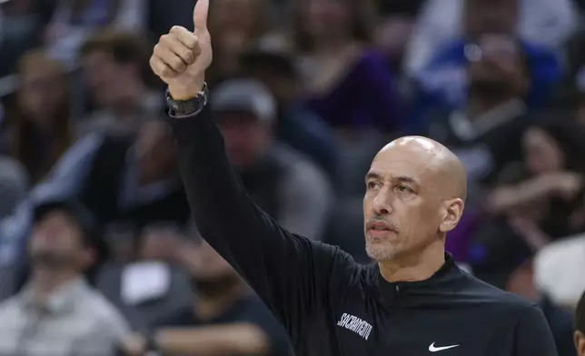 Sacramento Kings interim head coach Doug Christie gestures during the first half of an NBA basketball game against the Charlotte Hornets in Sacramento, Calif., Monday, Feb. 24, 2025. (AP Photo/Randall Benton)