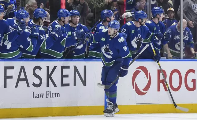 Vancouver Canucks' Jake DeBrusk (74) celebrates his goal against the Colorado Avalanche during the second period of an NHL hockey game in Vancouver, on Tuesday, Feb. 4, 2025. (Darryl Dyck/The Canadian Press via AP)