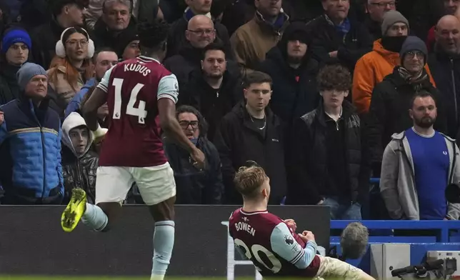 West Ham's Jarrod Bowen, bottom, celebrates after scoring his side's opening goal during the English Premier League soccer match between Chelsea and West Ham United at Stamford Bridge stadium in London, Monday, Feb. 3, 2025. (AP Photo/Kirsty Wigglesworth)