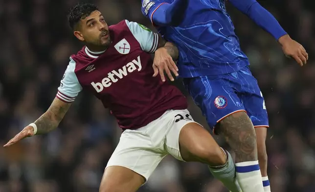 Chelsea's Reece James, top and West Ham's Emerson Palmieri challenge for the ball during the English Premier League soccer match between Chelsea and West Ham United at Stamford Bridge stadium in London, Monday, Feb. 3, 2025. (AP Photo/Kirsty Wigglesworth)