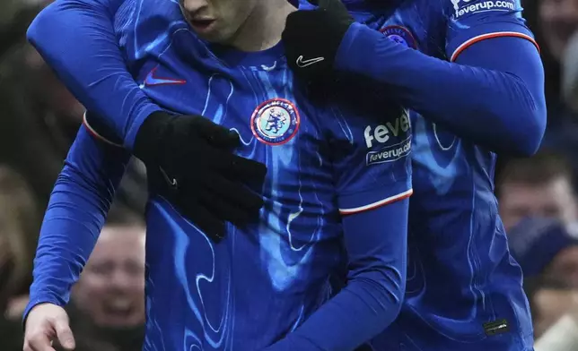 Chelsea's Cole Palmer, left, and Chelsea's Marc Guiu celebrate after an own goal by West Ham's Aaron Wan-Bissaka during the English Premier League soccer match between Chelsea and West Ham United at Stamford Bridge stadium in London, Monday, Feb. 3, 2025. (AP Photo/Kirsty Wigglesworth)