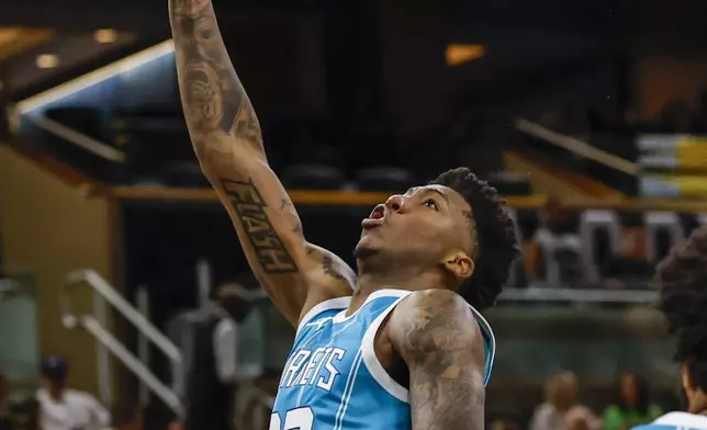 Charlotte Hornets guard Elfrid Payton shoots the ball against the Orlando Magic during the first half of an NBA basketball game, Wednesday, Feb. 12, 2025, in Orlando, Fla. (AP Photo/Kevin Kolczynski)
