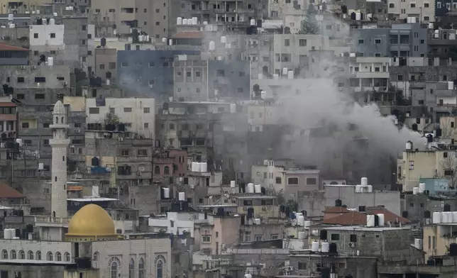 Smoke rises during an Israeli army operation in the West Bank refugee camp of Nur Shams, Tulkarem, on Tuesday, Feb. 11, 2025. (AP Photo/Majdi Mohammed)