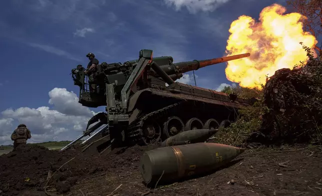 FILE - Ukrainian soldiers of 43rd artillery brigade fire by 2s7 self-propelled howitzer towards Russian positions at the frontline in Donetsk region, Ukraine, Monday, June 24, 2024. (AP Photo/Evgeniy Maloletka, File)