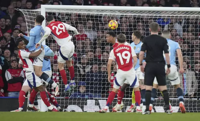 Manchester City's Josko Gvardiol, second from left, fails a chance to score during the English Premier League soccer match between Arsenal and Manchester City at the Emirates stadium in London, Sunday, Feb. 2, 2025. (AP Photo/Alastair Grant)