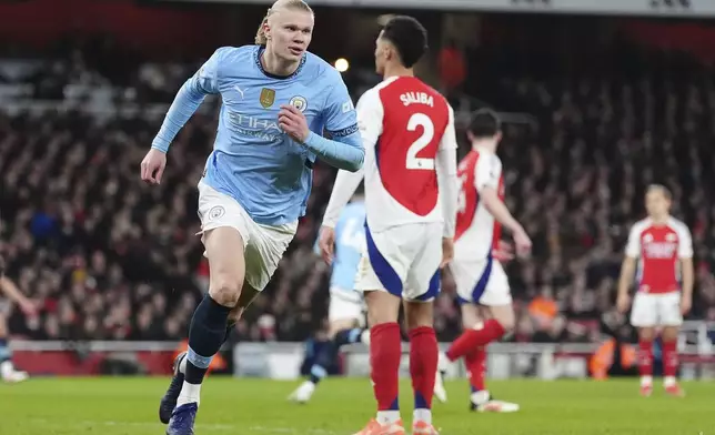 Manchester City's Erling Haaland celebrates scoring his side's first goal during the English Premier League soccer match between Arsenal and Manchester City at the Emirates stadium in London, Sunday, Feb. 2, 2025. (Adam Davy/PA via AP)