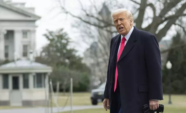 President Donald Trump responds to reporters as he walks on the South Lawn upon arrival at the White House, Saturday, Feb. 22, 2025, in Washington. (AP Photo/Manuel Balce Ceneta)