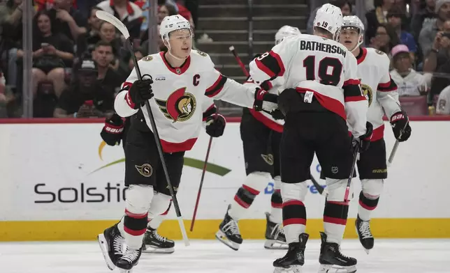 Ottawa Senators left wing Brady Tkachuk (7) reacts after scoring a goal during the first period of an NHL hockey game against the Florida Panthers Saturday, Feb. 8, 2025, in Sunrise, Fla. (AP Photo/Lynne Sladky)