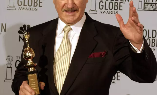 FILE - Gene Hackman holds his Cecil B. DeMille award at the 60th annual Golden Globe Awards in Beverly Hills, Calif. Sunday, Jan. 19, 2003. (AP Photo/Reed Saxon, File)