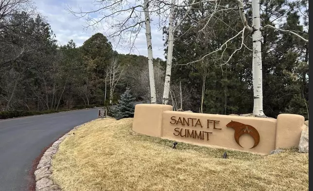 The entrance to the gated community where actor Gene Hackman, his wife Betsy Arakawa and their dog were found dead in their home is shown Thursday, Feb. 27, 2025 in Santa Fe, N.M. (AP Photo/Roberto Rosales)