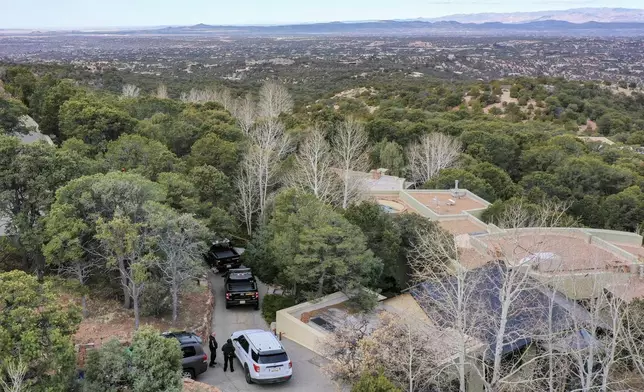 Santa Fe County deputies remain outside the house belonging to actor Gene Hackman and his wife Betsy Arakawa were earlier found dead, Thursday, Feb. 27, 2025 in Santa Fe, N.M. (AP Photo/Roberto E. Rosales)