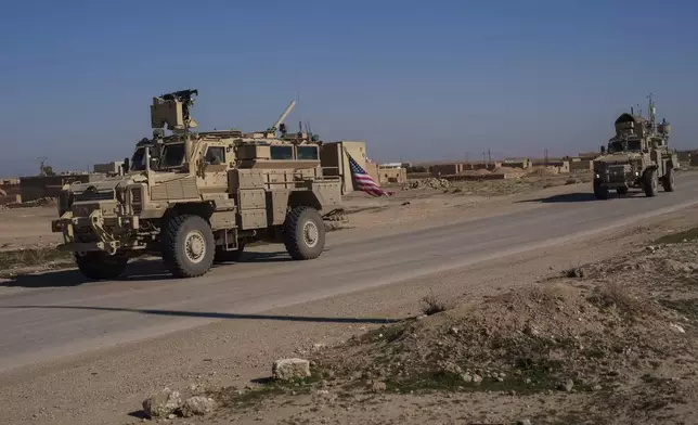 A U.S. military convoy drives along a road in northeastern Syria's Hasakeh province, Thursday, Jan. 30, 2025. (AP Photo/Bernat Armangue)
