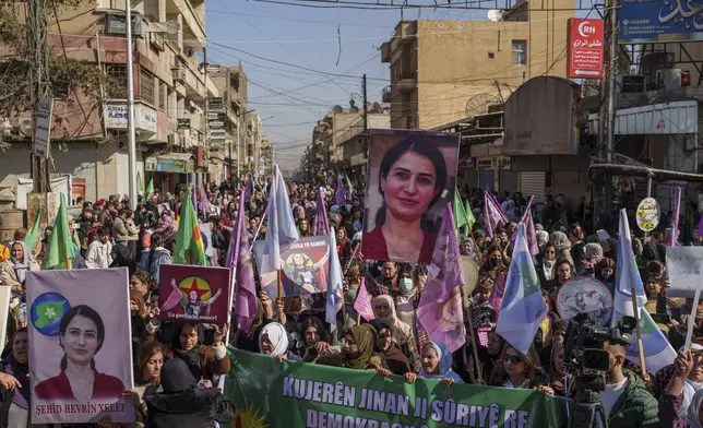 Women march during a rally to mark the 2019 killing of Kurdish politician Hevreen Khalaf by Turkey-backed opposition fighters, in the northeastern Syrian city of Qamishli, Saturday, Feb. 1, 2025. (AP Photo/Bernat Armangue)