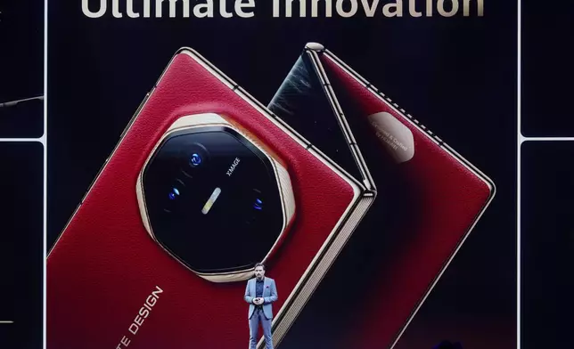 Andreas Zimmer, Huawei's head of product speaks during the global sales opening of Huawei's industry's first tri-foldable phone in Kuala Lumpur, Malaysia, Tuesday, Feb. 18, 2025. (AP Photo/Vincent Thian)