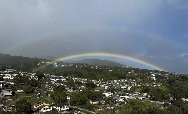 Two rainbows are seen in the sky on April 24, 2024, in Honolulu. (AP Photo/Audrey McAvoy)