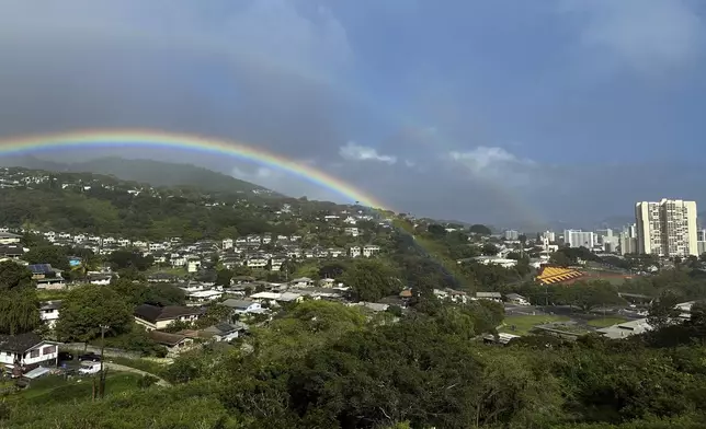 Two rainbows are seen in the sky on April 24, 2024, in Honolulu. (AP Photo/Audrey McAvoy)