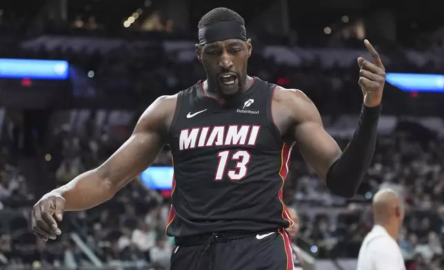 Miami Heat center Bam Adebayo (13) reacts to a play during the first half of an NBA basketball game against the San Antonio Spurs in San Antonio, Saturday, Feb. 1, 2025. (AP Photo/Eric Gay)