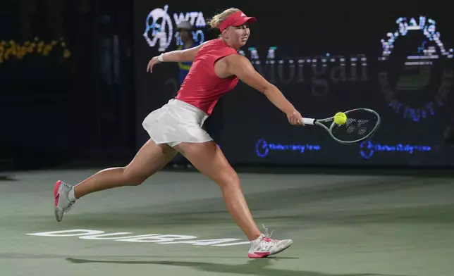 Denmark's Clara Tauson returns to Russia's Mirra Andreeva during the Dubai Duty Free Tennis Championship final match in Dubai, United Arab Emirates, on Saturday, Feb. 22, 2025. (AP Photo/Altaf Qadri)