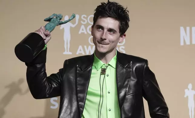 Timothee Chalamet poses in the press room with the award for outstanding performance by a male actor in a leading role for "A Complete Unknown" during the 31st annual Screen Actors Guild Awards on Sunday, Feb. 23, 2025, at the Shrine Auditorium in Los Angeles. (Photo by Jordan Strauss/Invision/AP)