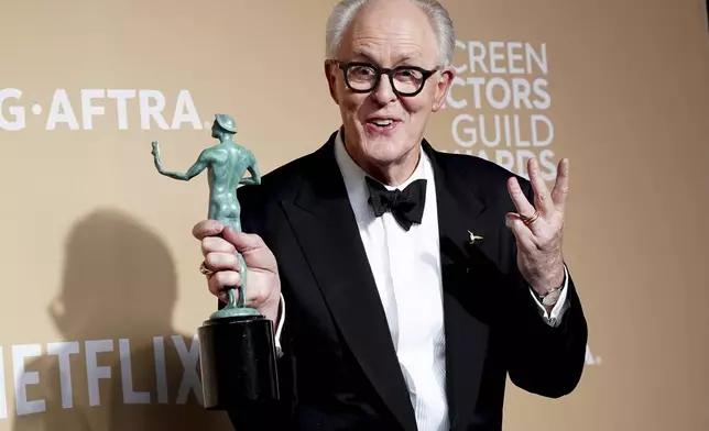 John Lithgow poses with the award for outstanding performance by a cast in a motion picture for "Conclave" during the 31st annual Screen Actors Guild Awards on Sunday, Feb. 23, 2025, at the Shrine Auditorium in Los Angeles. (Photo by Jordan Strauss/Invision/AP)