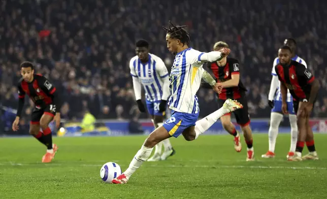 Brighton and Hove Albion's Joao Pedro scores his side's first goal of the game from the penalty spot during the English Premier League soccer match between Brighton and Hove Albion and AFC Bournemouth, at American Express Stadium, Brighton, England, Tuesday Feb. 25, 2025. (Steven Paston/PA via AP)