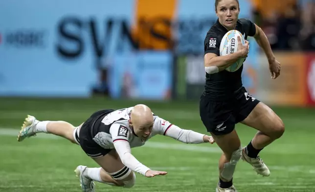 Canada's Oliva Apps dives after New Zealand's Michaela Brake during Vancouver Sevens quarter final women's rugby match in Vancouver, B.C., Saturday, Feb. 22, 2025. (Ethan Cairns/The Canadian Press via AP)