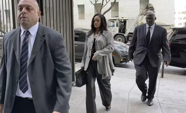 Singer Rihanna, center, returns to Clara Shortridge Foltz Criminal Justice Center in Los Angeles on Friday, Jan. 31, 2025. (AP Photo/Liam McEwan)