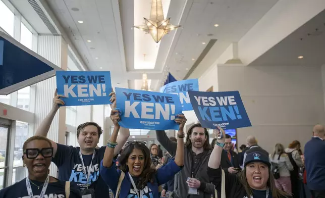 Supporters and volunteers of DNC chair candidate Ken Martin cheer outside of the ballroom in the hours prior to the votes for positions at the Democratic National Committee Winter Meeting at the Gaylord National Resort and Convention Center in National Harbor, Md., Saturday, Feb. 1, 2025. (AP Photo/Rod Lamkey, Jr.)