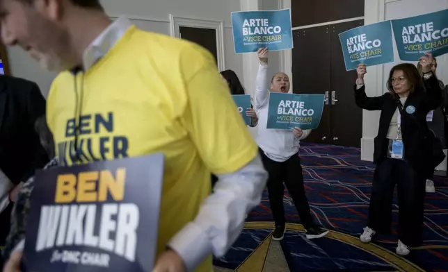 Supporters of DNC candidates rally outside of the ballroom in the hours prior to the votes for positions at the Democratic National Committee Winter Meeting at the Gaylord National Resort and Convention Center in National Harbor, Md., Saturday, Feb. 1, 2025. (AP Photo/Rod Lamkey, Jr.)