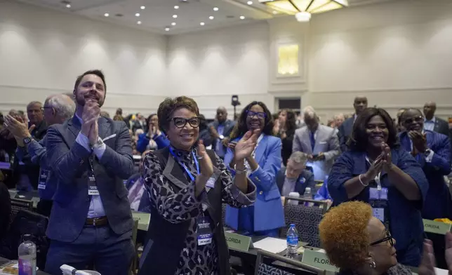 Attendees cheer as Ken Martin is announced as the newly elected Democratic National Committee Chairman after winning the vote at the Democratic National Committee Winter Meeting at the Gaylord National Resort and Convention Center in National Harbor, Md., Saturday, Feb. 1, 2025. (AP Photo/Rod Lamkey, Jr.)