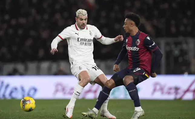 Bologna's Lewis Ferguson, left, and Milan's Tijjani Reijnders in action during the Serie A soccer match between Bologna FC and A.C. Milan at Renato Dall'Ara Stadium, Bologna, Italy, Thursday, Feb. 27, 2025. (Massimo Paolone/LaPresse via AP)