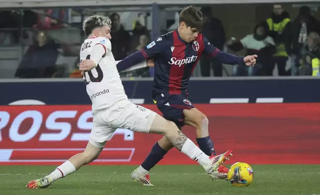 Bologna's Benjamin Dominguez, right, and Milan's Alex Jimenez in action during the Serie A soccer match between Bologna FC and A.C. Milan at Renato Dall'Ara Stadium, Bologna, Italy, Thursday, Feb. 27, 2025. (Michele Nucci/LaPresse via AP)