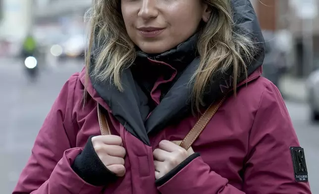 Ketevan Asatiani-Hermann, 35 years old, coming to Germany from Georgia in 2011, pose for a photo during an interview with the Associated Press in Magdeburg, Germany, Friday, Feb. 7, 2025. (AP Photo/Ebrahim Noroozi)
